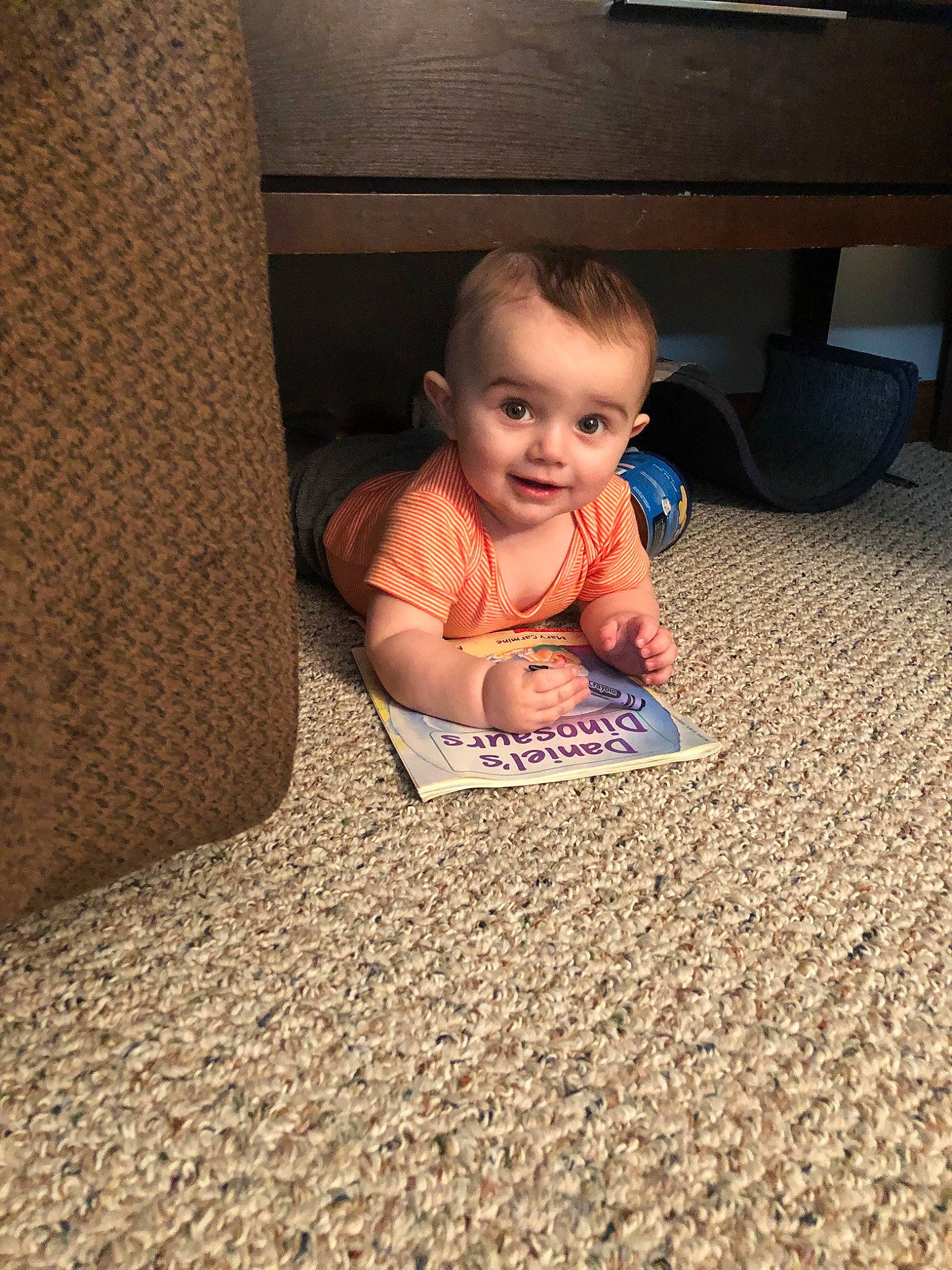 Killian is registered to the contest to win money with this photo: baby, carpet, cheek, child, crawling, electronic_device, face, family, floor, flooring, head, people, person, play, room, sitting, skin, technology, toddler, vacation