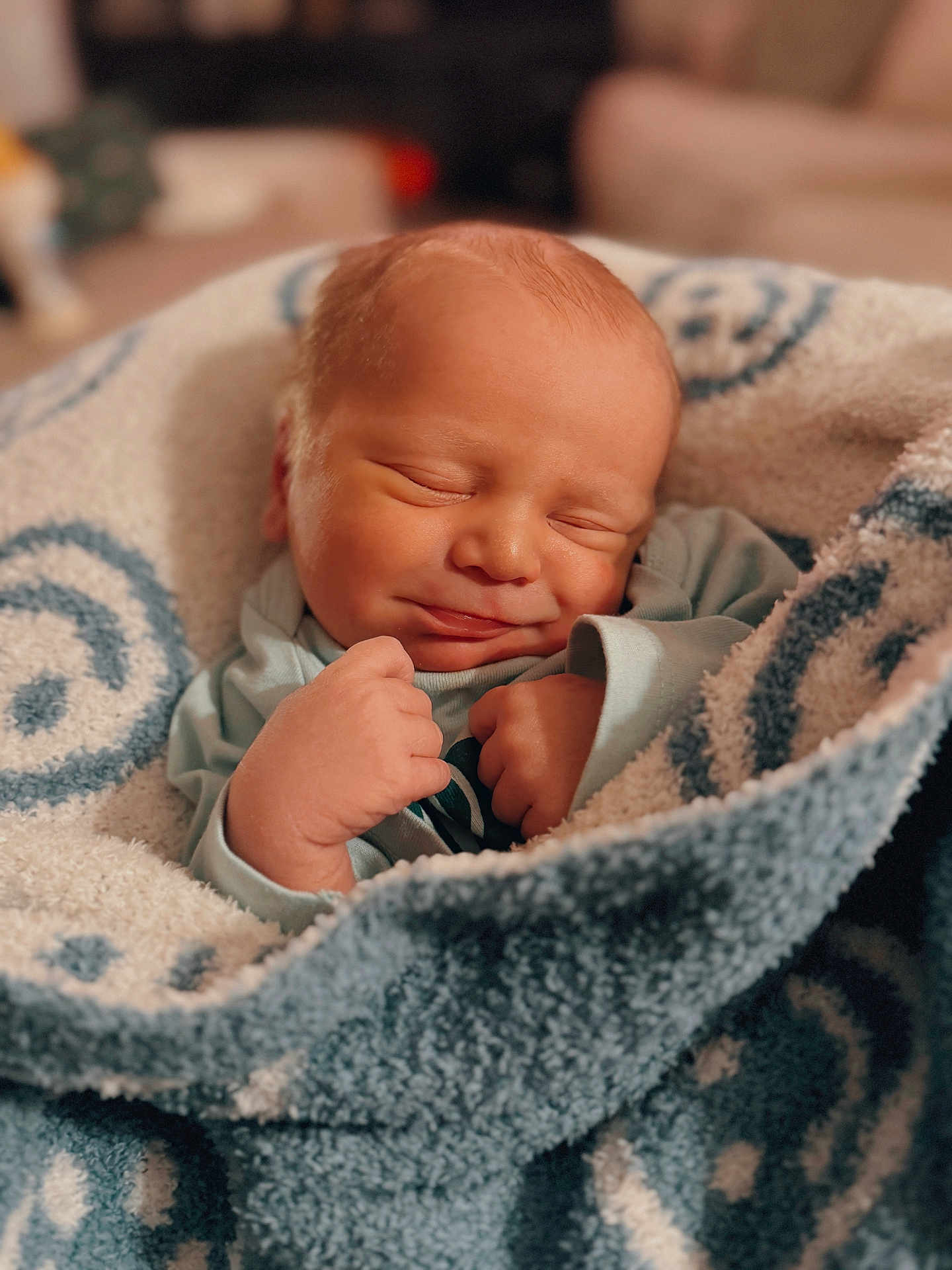 Bohdi joined the competition — help win amazing prizes! baby, newborn, sleeping, blanket, soft_texture, cozy, indoor, infant, wrapped, serene, smile, cute, peaceful, closeup, portrait, child, warm_lighting, hands, clothing, resting