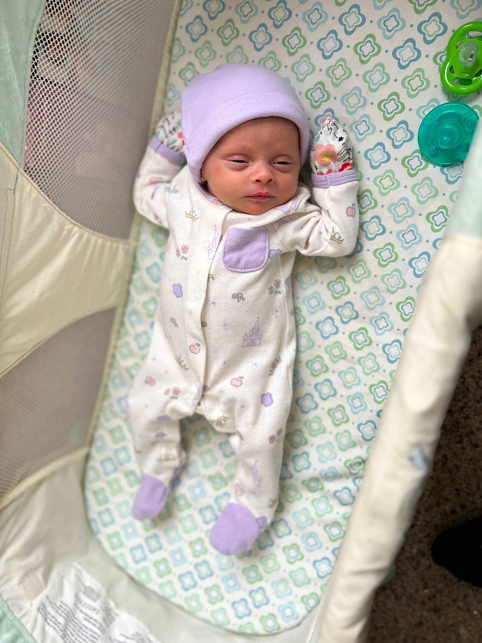 Emmalyn is registered to the contest to win money with this photo: baby, baby_products, baby_safety, baby_sleeping, baby_toddler_clothing, bedding, child, comfort, face, headwear, infant_bed, linens, pattern, person, purple, room, sleeve, textile, toddler