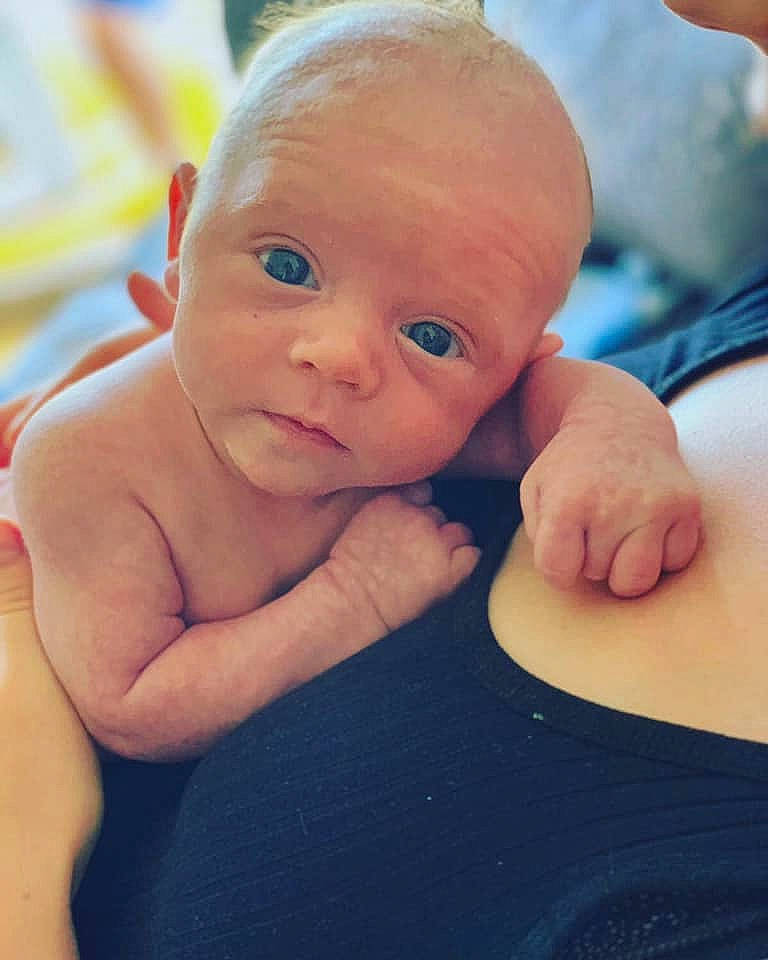 Bertie is registered to the contest to win money with this photo: arm, baby, baby_bathing, baby_making_funny_faces, cheek, chest, child, chin, eye, face, hand, head, lip, muscle, neck, nose, person, skin, smile, toddler