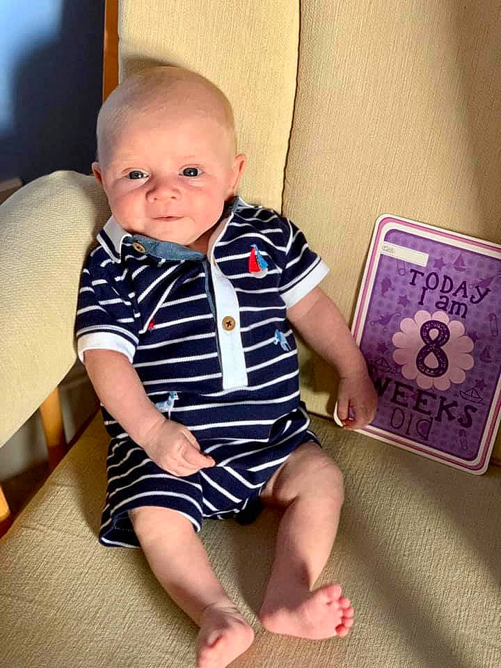 Bertie is registered to the contest to win money with this photo: baby, baby_toddler_clothing, cheek, child, leg, person, sitting, t_shirt, toddler