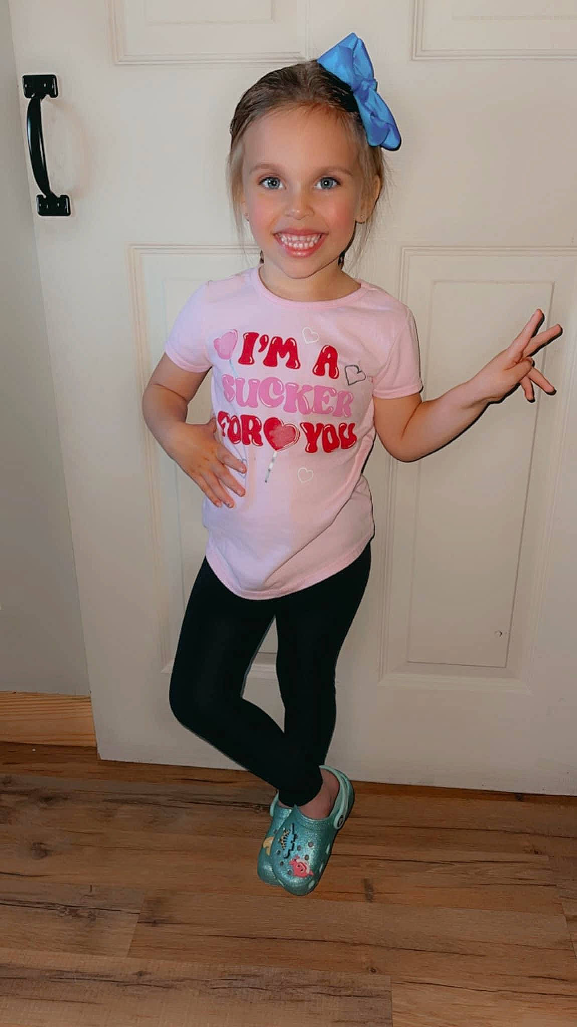 Kassidy is registered to the contest to win money with this photo: active_pants, arm, baby_toddler_clothing, blue, cool, dance, entertainment, happy, joint, joy, knee, person, pink, shoulder, sleeve, smile, sportswear, standing, t_shirt, thigh
