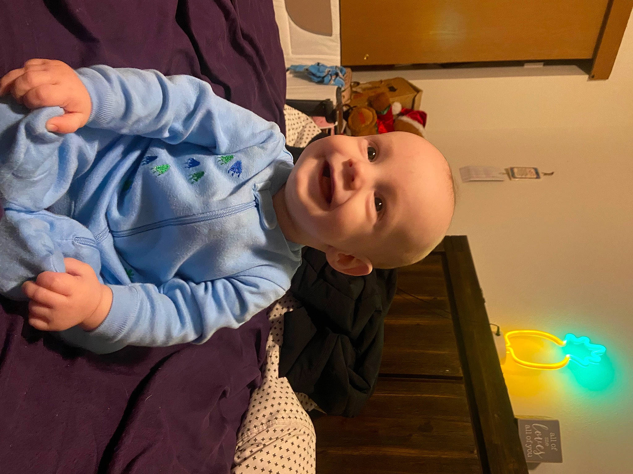 Graysen joined the competition — help win amazing prizes! baby, baby_products, baby_toddler_clothing, cheek, child, facial_expression, fun, gesture, happy, hat, human_body, laugh, mouth, nose, person, room, sitting, sleeve, smile, t_shirt