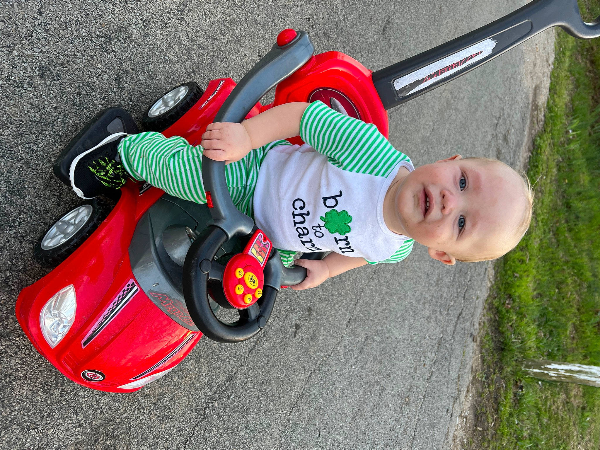 Weston joined the competition — help win amazing prizes! automotive_design, baby, baby_products, baby_toddler_clothing, car, carmine, child, footwear, grass, musical_instrument, person, plant, recreation, riding_toy, shoe, sneakers, tire, toddler, toy, vehicle