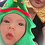 adult, baby, celebration, child, christmas_tree_hat, closeup, costume, cute, face, festive, filter, fun, gold, green, headwear, holiday, portrait, red, sparkle, star