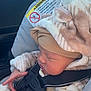 Scarlet is registered to the contest to win money with this photo: baby, car_seat, child, infant, sleeping, hat, clothing, car_interior, seat_belt, warning_label, safety, warm, fuzzy, striped, cute, small_hand, closeup, face, resting, transport