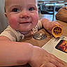 Scarlet joined the competition — help win amazing prizes! baby, casual, child, close_up, coin, crumbs, dining, face, family, food, hand, happy, indoor, infant, portrait, restaurant, smiling, table, waffle, wooden_table
