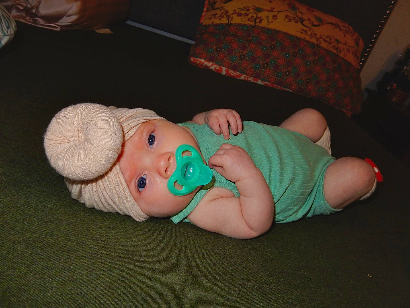 Miley joined the competition — help win amazing prizes! baby, baby_toddler_clothing, cheek, child, comfort, couch, finger, foot, fun, grass, hat, headwear, human_body, human_leg, knee, lap, person, room, sitting, textile