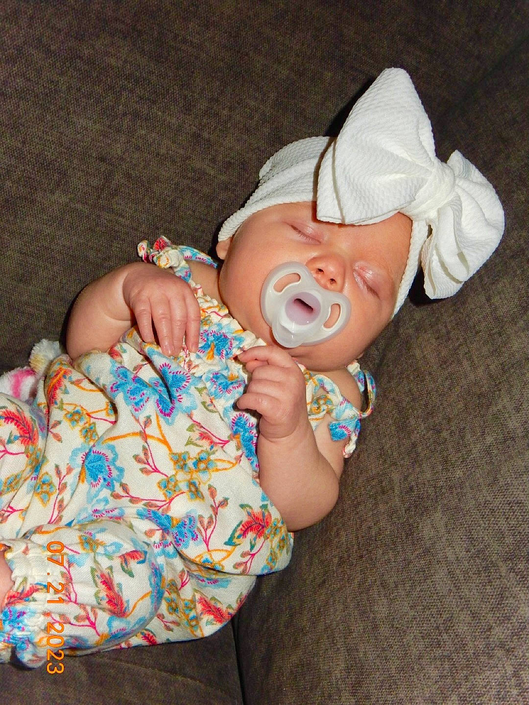 Miley is registered to the contest to win money with this photo: baby, baby_products, baby_toddler_clothing, child, comfort, event, fashion_accessory, finger, fun, hand, happy, hat, headwear, nail, pattern, person, skin, sleeve, sweetness, thumb