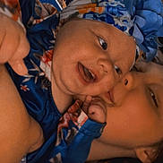 Ella is registered to the contest to win money with this photo: adult, affection, baby, blue, child, closeup, clothing, cuddle, face, family, floral, hand, happy, headband, indoor, love, person, portrait, skin, smiling