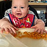 Oscar is registered to the contest to win money with this photo: baby, bathing, bathtub, bodypart, couch, cutlery, eating, face, finger, food, furniture, hand, head, lunch, meal, person, photography, portrait, spoon, tub
