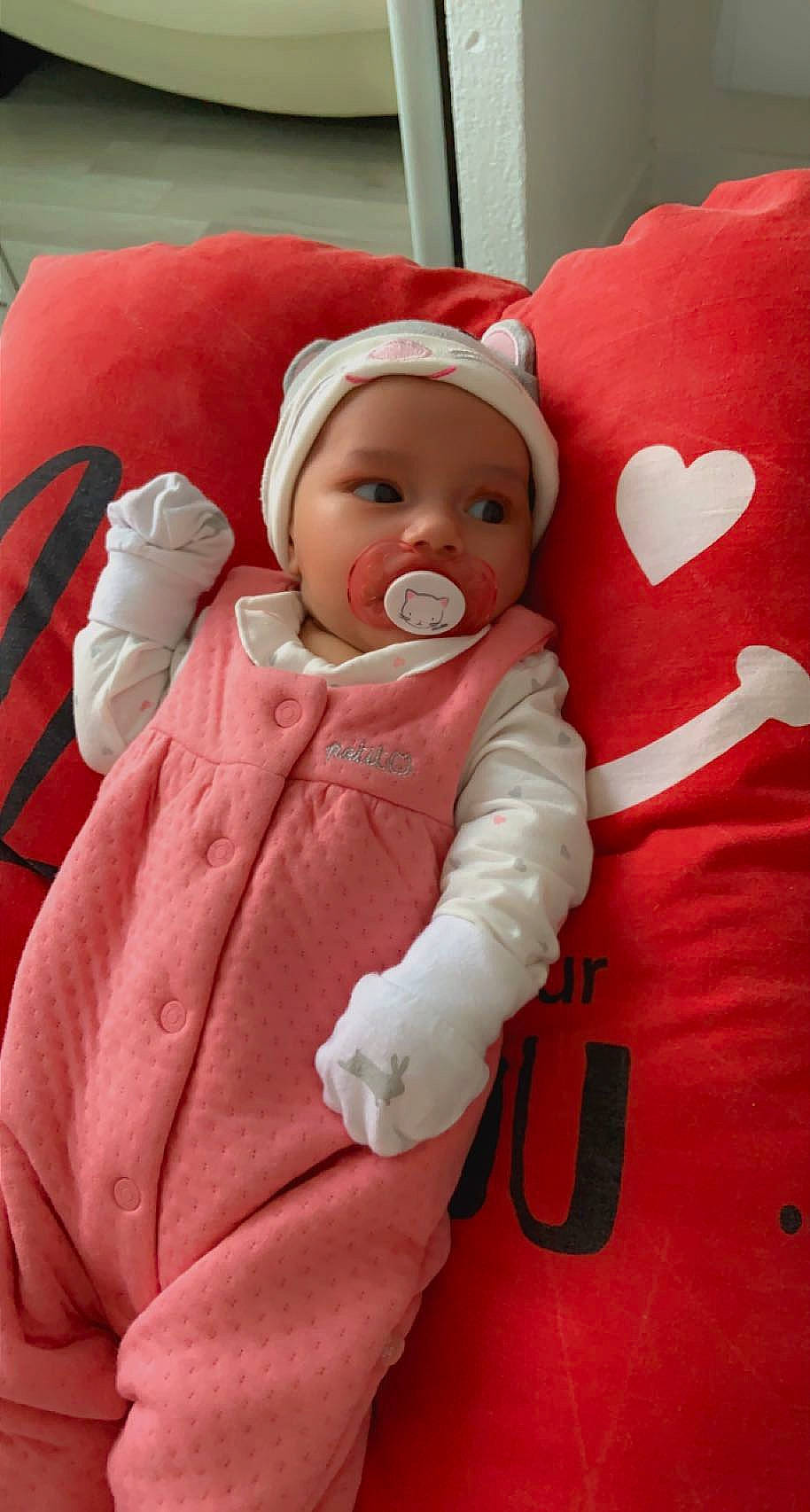 Eden Maria participe au concours pour gagner de l'argent avec cette photo : baby, baby_products, baby_sleeping, baby_toddler_clothing, beanie, cap, carmine, cheek, child, comfort, face, fur, headwear, linens, mouth, person, pink, red, skin, toddler