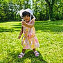 Saanvhi joined the competition — help win amazing prizes! toddler, child, outdoor, grass, flower, hat, dress, sunlight, shadow, nature, greenery, summer, smiling, sandals, cute, portrait, playing, happy, person, daytime