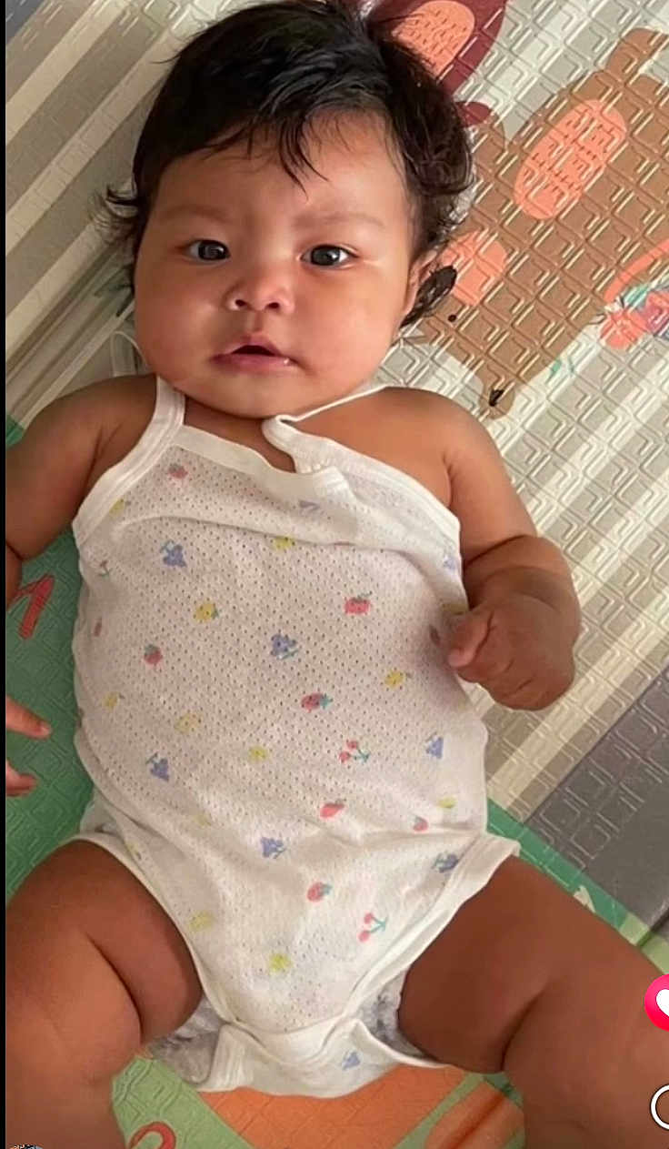 Miko joined the competition — help win amazing prizes! baby, infant, child, onesie, play_mat, cute, chubby, lying_down, curious, dark_hair, skin, indoor, colorful, patterned_clothing, young_child, portrait, baby_girl, baby_boy, soft_lighting, close_up