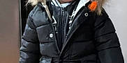 Kingston joined the competition — help win amazing prizes! child, winter_clothing, black_jacket, beanie, indoor, standing, floor, wooden_floor, casual, smiling, young, person, face, pants, hood, fur_trim, zipper, warm_clothes, home, fashion