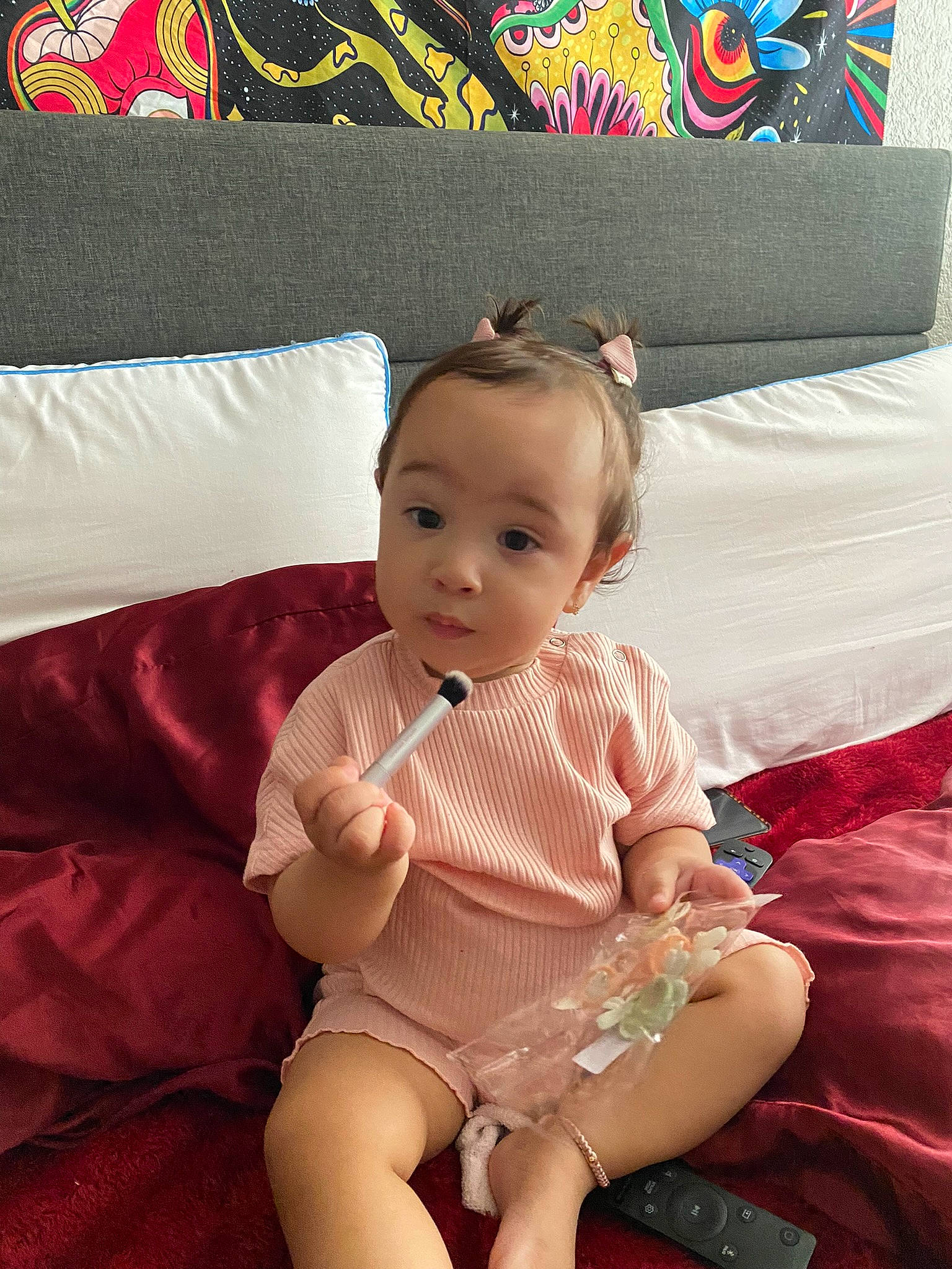 Leila is registered to the contest to win money with this photo: baby, baby_toddler_clothing, comfort, couch, eye, foot, happy, head, human_body, lap, mammal, person, picture_frame, pillow, pink, rectangle, skin, textile, thigh, toddler