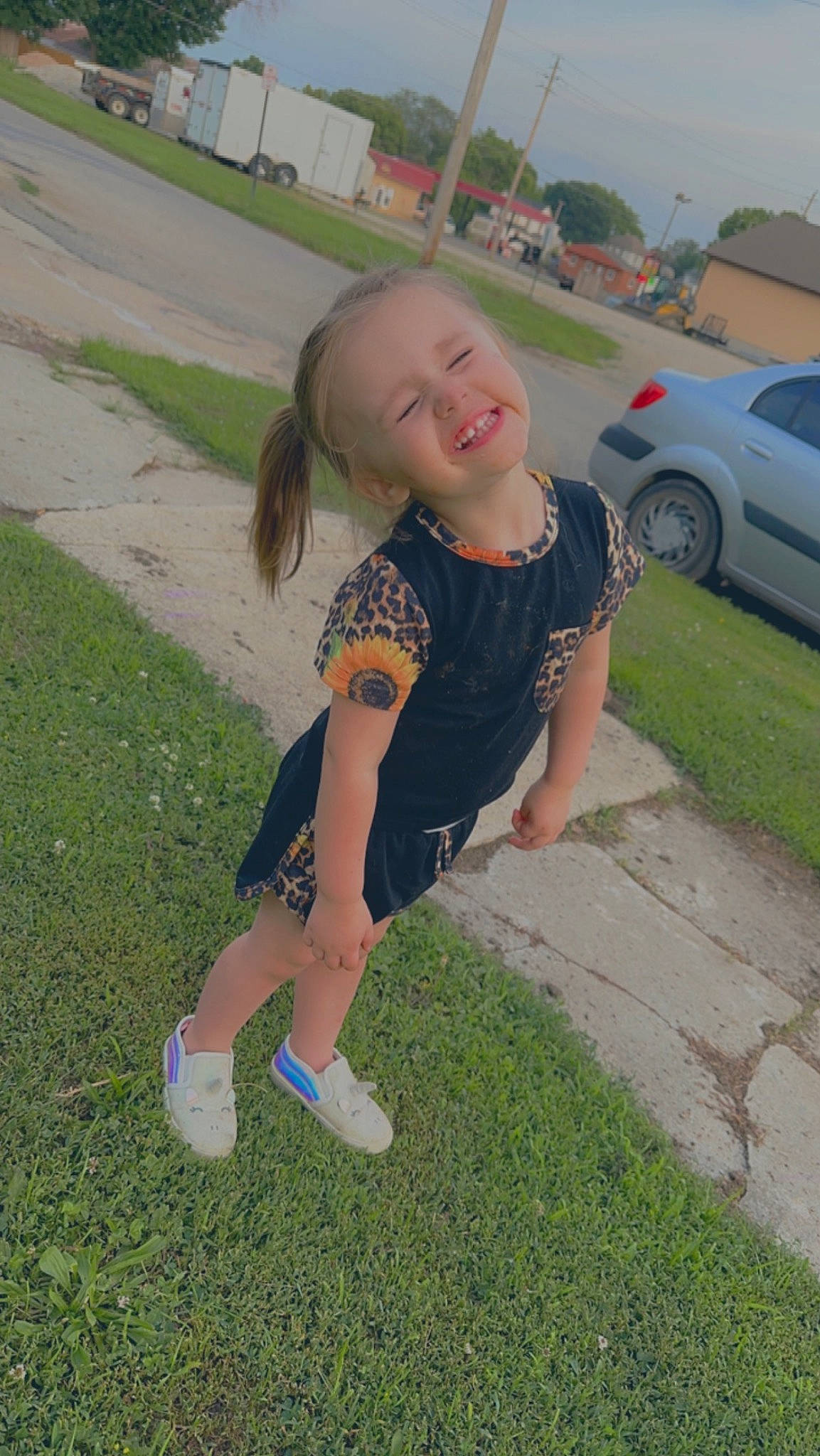 Harlee is registered to the contest to win money with this photo: asphalt, barefoot, car, fun, grass, grass_family, happy, human_leg, joy, lawn, leg, leisure, people_in_nature, person, plant, recreation, smile, t_shirt, thigh, tire