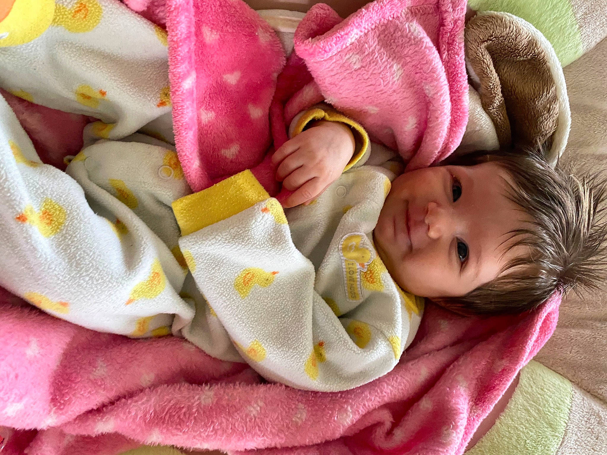 Gwyneth is registered to the contest to win money with this photo: baby, blanket, child, linens, person, pink, sleep, textile, toddler