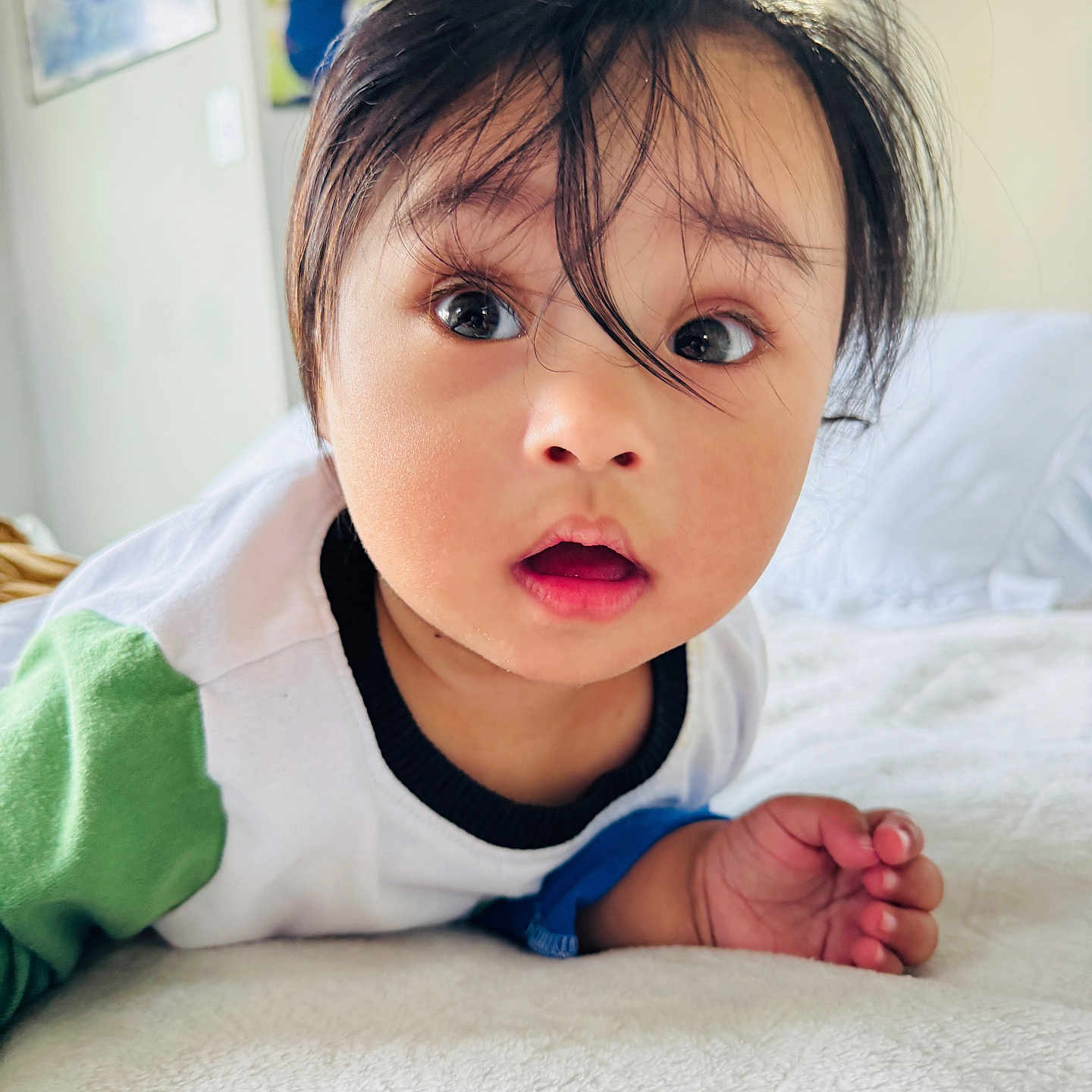 Kiyan is registered to the contest to win money with this photo: baby, bed, blanket, candid, child, clothing, curious, expression, eyes, face, hair, hand, home, indoor, person, photography, portrait, skin, toddler, young