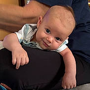 Ezra joined the competition — help win amazing prizes! adult, arm, baby, child, closeup, clothing, curious, cute, expression, eyes, face, hand, head, indoor, infant, lap, person, resting, skin, smile
