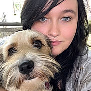 Harper Grace is registered to the contest to win money with this photo: woman, dog, pet, selfie, portrait, face, cuddling, fur, black_hair, blue_eyes, tattoo, casual_clothing, indoor, closeup, cute, animal, companion, love, happy, relaxed