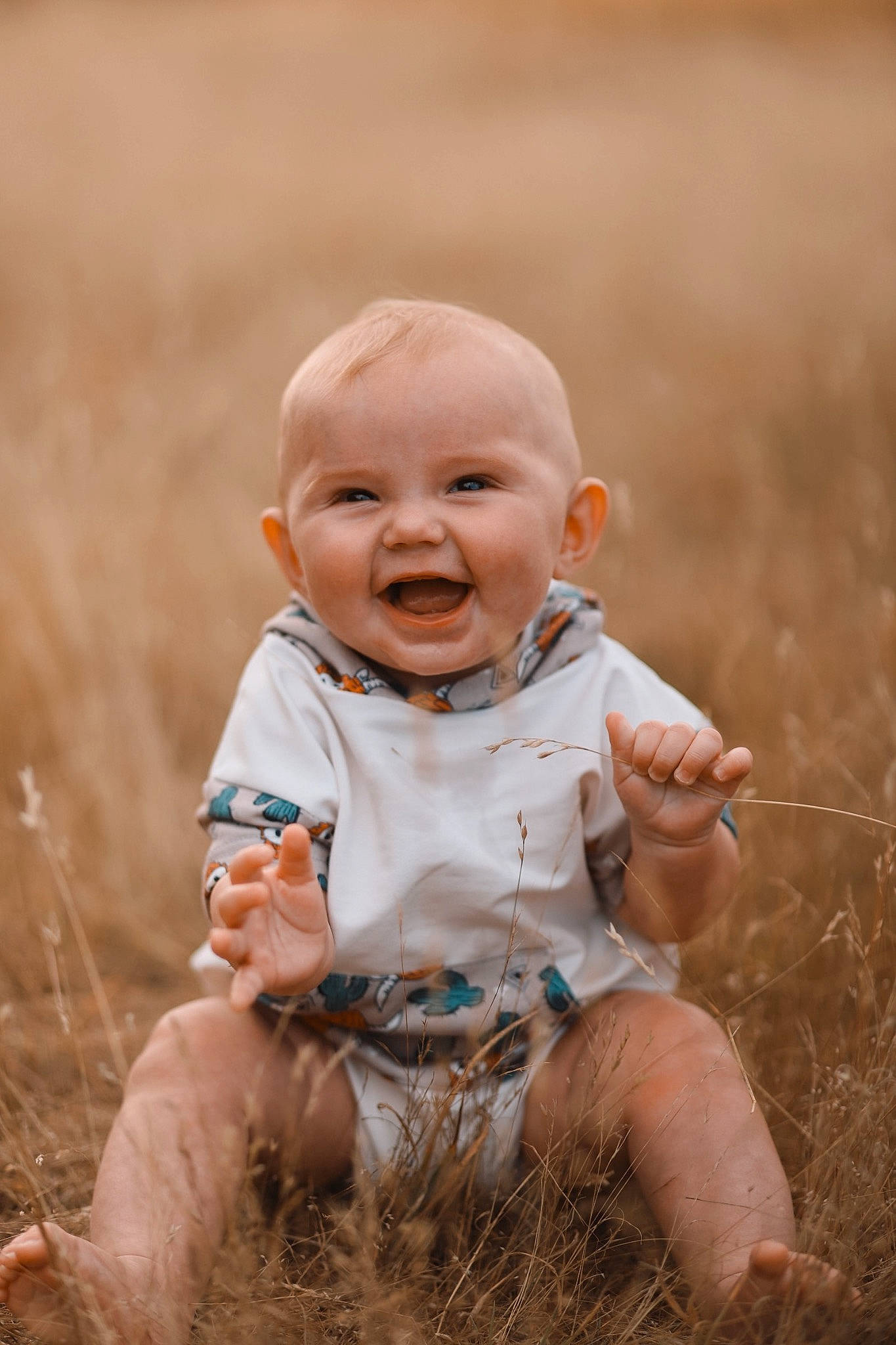 Cash joined the competition — help win amazing prizes! baby, baby_toddler_clothing, child, face, flash_photography, fun, gesture, grass, grassland, happy, landscape, people_in_nature, person, prairie, sitting, skin, smile, soil, toddler, vertebrate