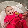 Inaya participe au concours pour gagner de l'argent avec cette photo : baby, smiling, infant, feeding, spoon, pink_clothing, baby_seat, happy, cute, child, indoor, floor, person, hand, mouth_open, cheerful, seat, cushion, feeding_time, human