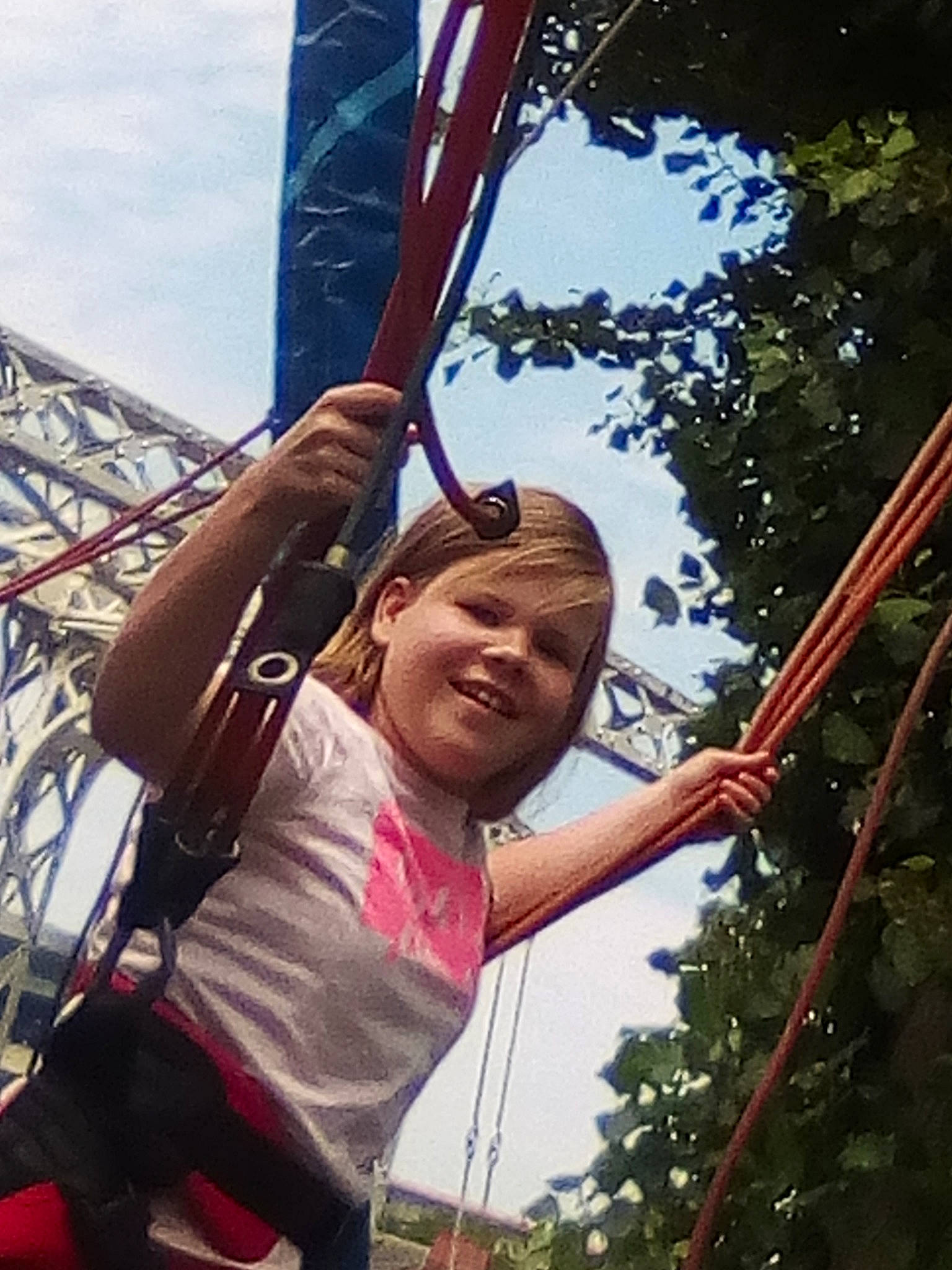 Celia Eryna participe au concours pour gagner de l'argent avec cette photo : child, city, cloud, fun, happy, joy, leisure, outdoor_play_equipment, person, plant, play, playground, pole, recreation, rope, shorts, sky, swing, t_shirt, toddler