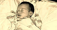 Kaizen joined the competition — help win amazing prizes! baby, newborn, sleeping, blanket, bed, pattern, swaddle, infant, face, person, cozy, cute, indoors, soft, resting, digital_clock, text_overlay, love, heart, emoji