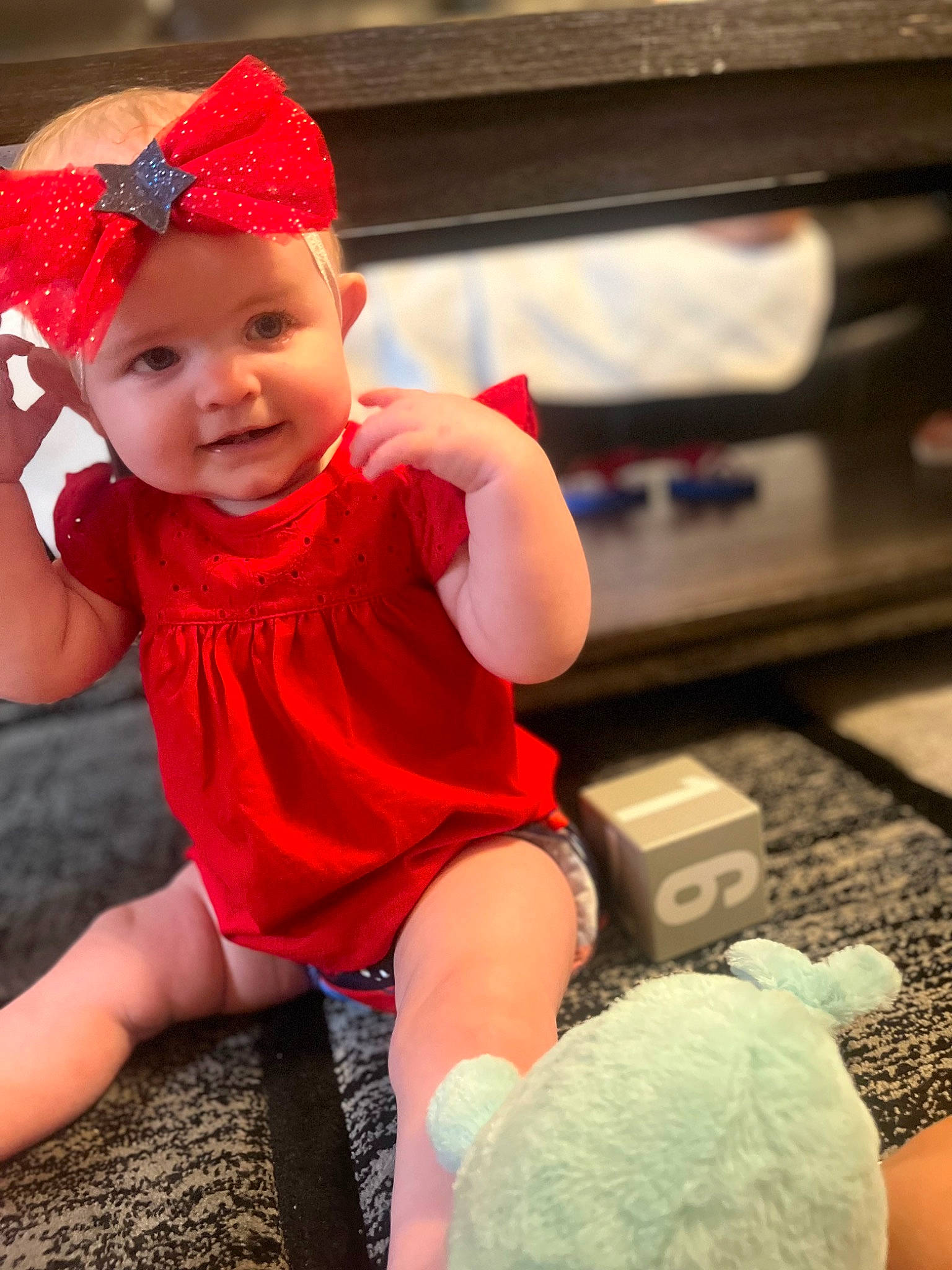Scarlet joined the competition — help win amazing prizes! baby, baby_toddler_clothing, cap, child, finger, fun, happy, headband, headwear, human_leg, leisure, magenta, person, pink, play, product, sitting, skin, smile, sock