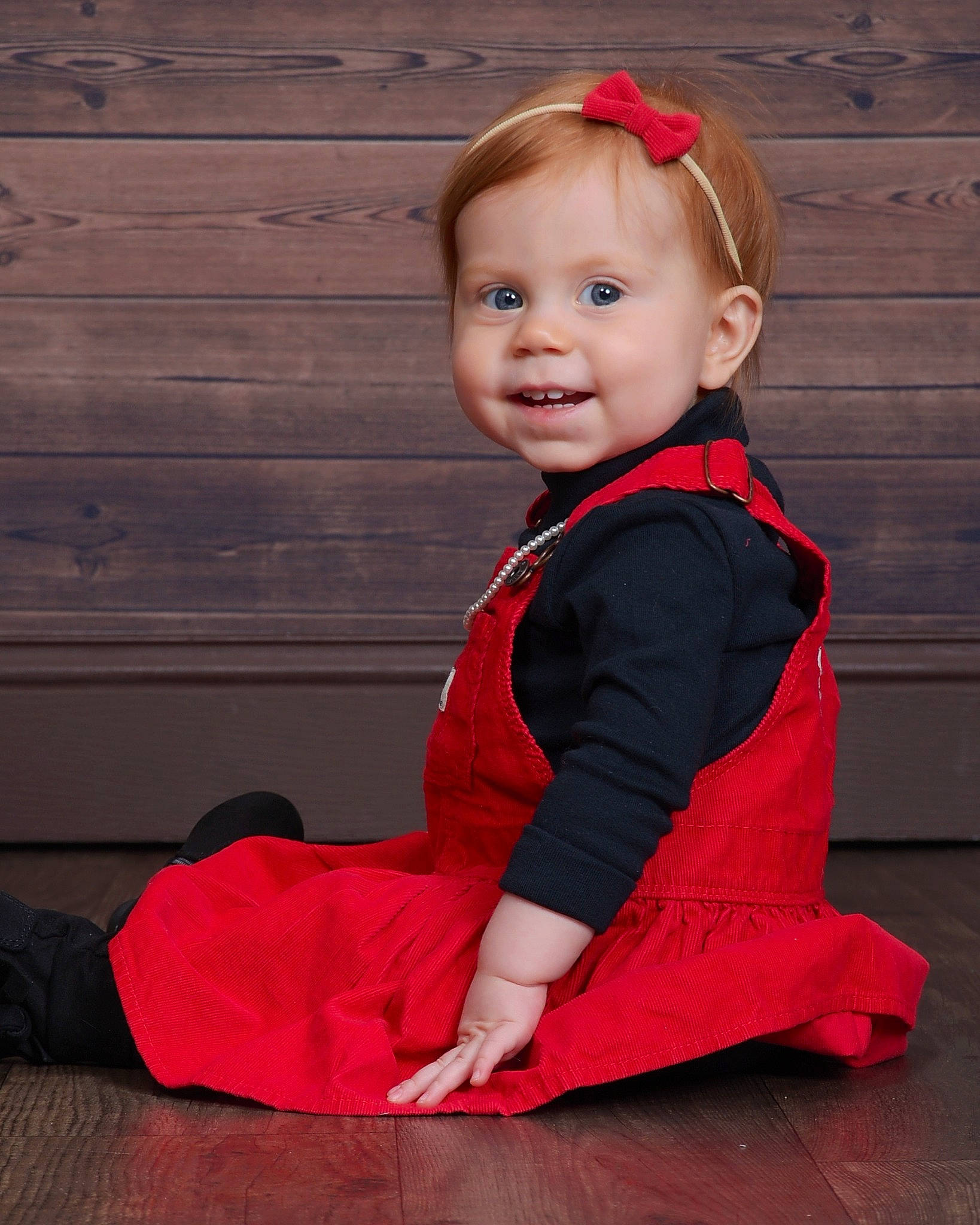 Emma Rose is registered to the contest to win money with this photo: baby, baby_toddler_clothing, child, dress, face, facial_expression, flooring, formal_wear, happy, hardwood, magenta, outerwear, pattern, person, pink, red, skin, sleeve, smile, toddler