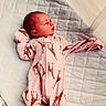 baby, newborn, sleeping, infant, pink, onesie, giraffe_pattern, quilt, blanket, bed, child, peaceful, cute, soft, clothing, portrait, rest, young, indoors, person