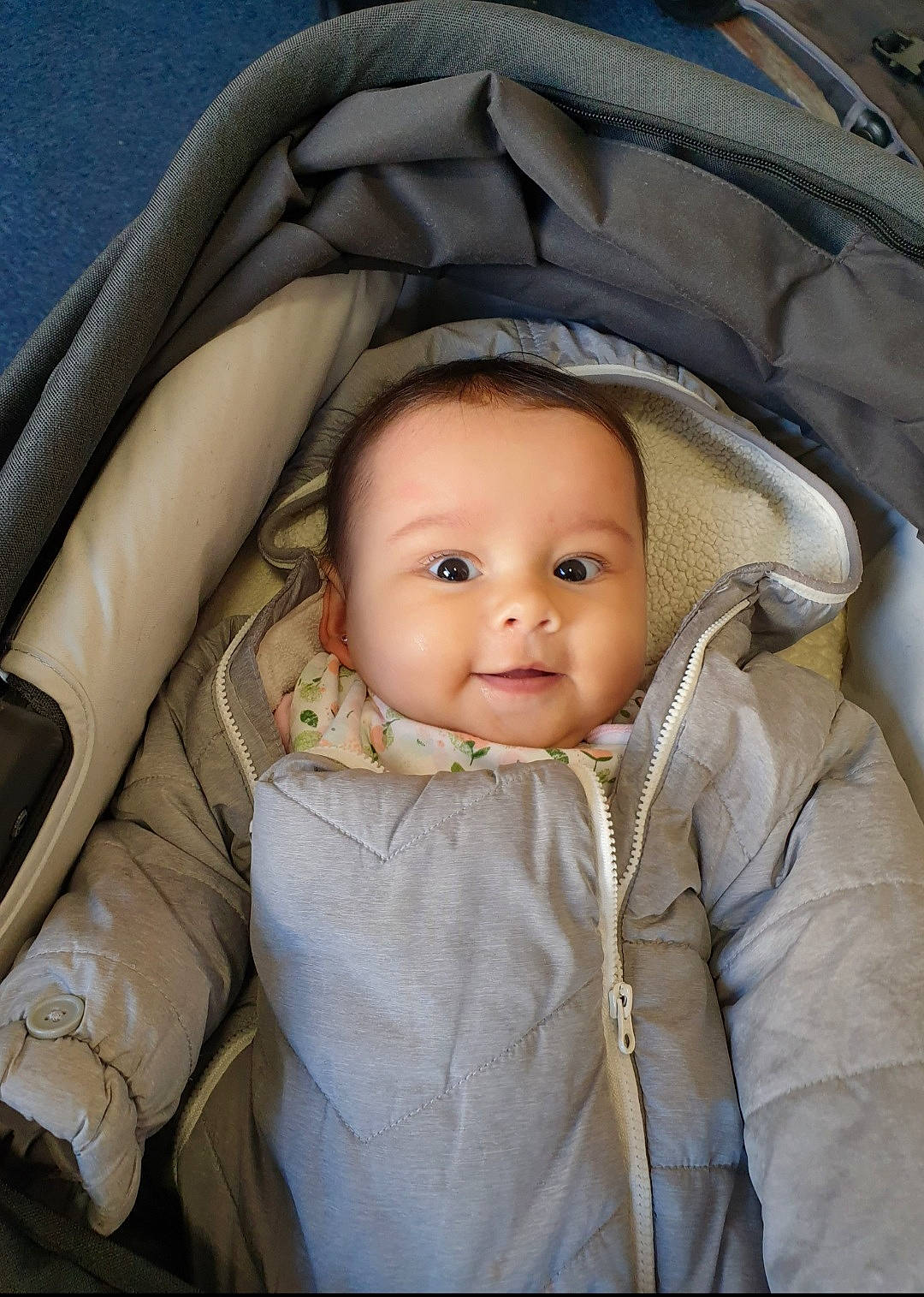 Lia joined the competition — help win amazing prizes! baby, baby_carriage, baby_products, baby_safety, baby_toddler_clothing, brown, cheek, child, comfort, eye, eyebrow, flash_photography, iris, organ, outerwear, person, sitting, skin, sleeve, smile