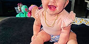 Sky is registered to the contest to win money with this photo: accessories, baby, clothing, costume, diaper, dress, face, furniture, happy, hat, head, indoors, jewelry, necklace, person, photoframe, photography, portrait, sitting, swimwear