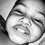 Jamarie Carr joined the competition — help win amazing prizes! child, smile, face, closeup, black_and_white, portrait, happy, lying_down, expression, person, skin, teeth, eye, eyelashes, nose, mouth, head, texture, clothing, candid