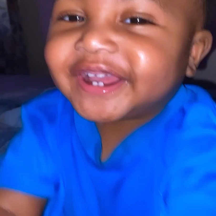 Jamarie Carr is registered to the contest to win money with this photo: arm, baby, blue_shirt, cheeks, child, cute, eyes, face, happy, head, indoor, joyful, laughing, mouth, person, portrait, skin, smiling, toddler, young_child