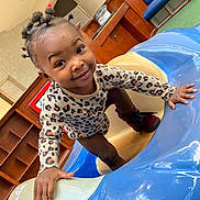 Jarhylee is registered to the contest to win money with this photo: toddler, child, smile, indoor, playground, climbing, leopard_print, hair_style, boots, plastic, blue, cream, hand, face, furniture, wood, shelf, curious, happy, person