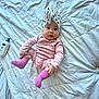 Zoey is registered to the contest to win money with this photo: baby, infant, pink_pajamas, pink_socks, white_turban, polka_dots, bed, white_bedspread, baby_lotion, bottle, cute, child, indoor, lying_down, person, soft_lighting, cozy, skin_care, sleepwear, portrait
