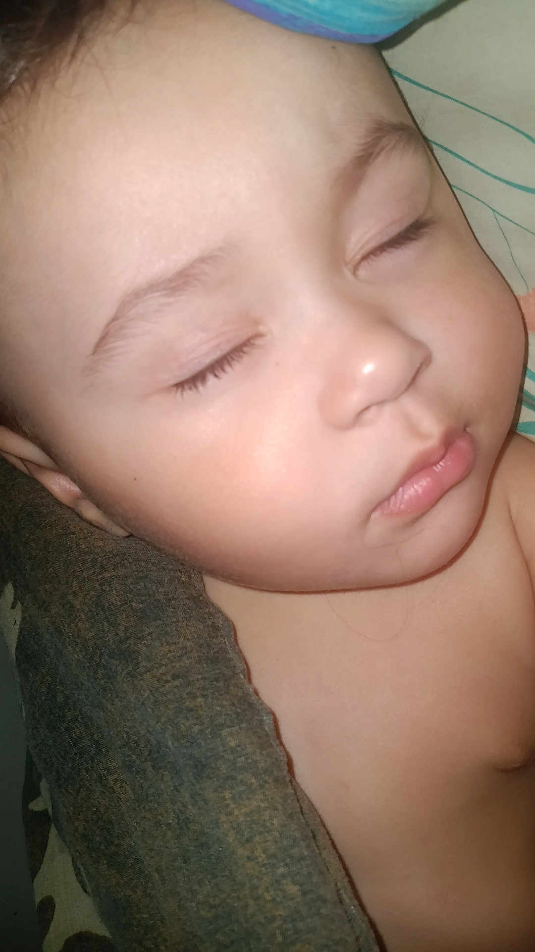 Blake is registered to the contest to win money with this photo: baby, sleeping, close_up, face, skin, eyelashes, blanket, peaceful, child, portrait, infant, rest, cute, young, soft, calm, indoors, head, nose, lips