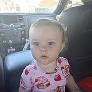Sofia joined the competition — help win amazing prizes! toddler, child, car_interior, seat, leather_seat, dashboard, clothing, curly_hair, face, portrait, indoor, seatbelt, window, daylight, person, cute, expression, young_child, casual, pink_shirt