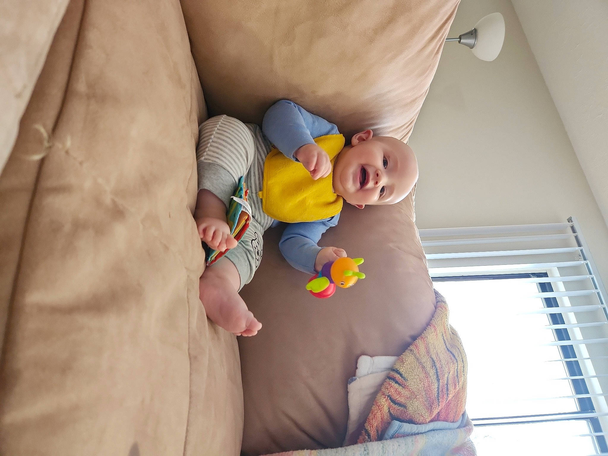Micah is registered to the contest to win money with this photo: abdomen, arm, baby, baby_products, baby_sleeping, child, comfort, finger, flooring, gesture, hand, happy, human_body, joint, mouth, nail, person, skin, stomach, toddler