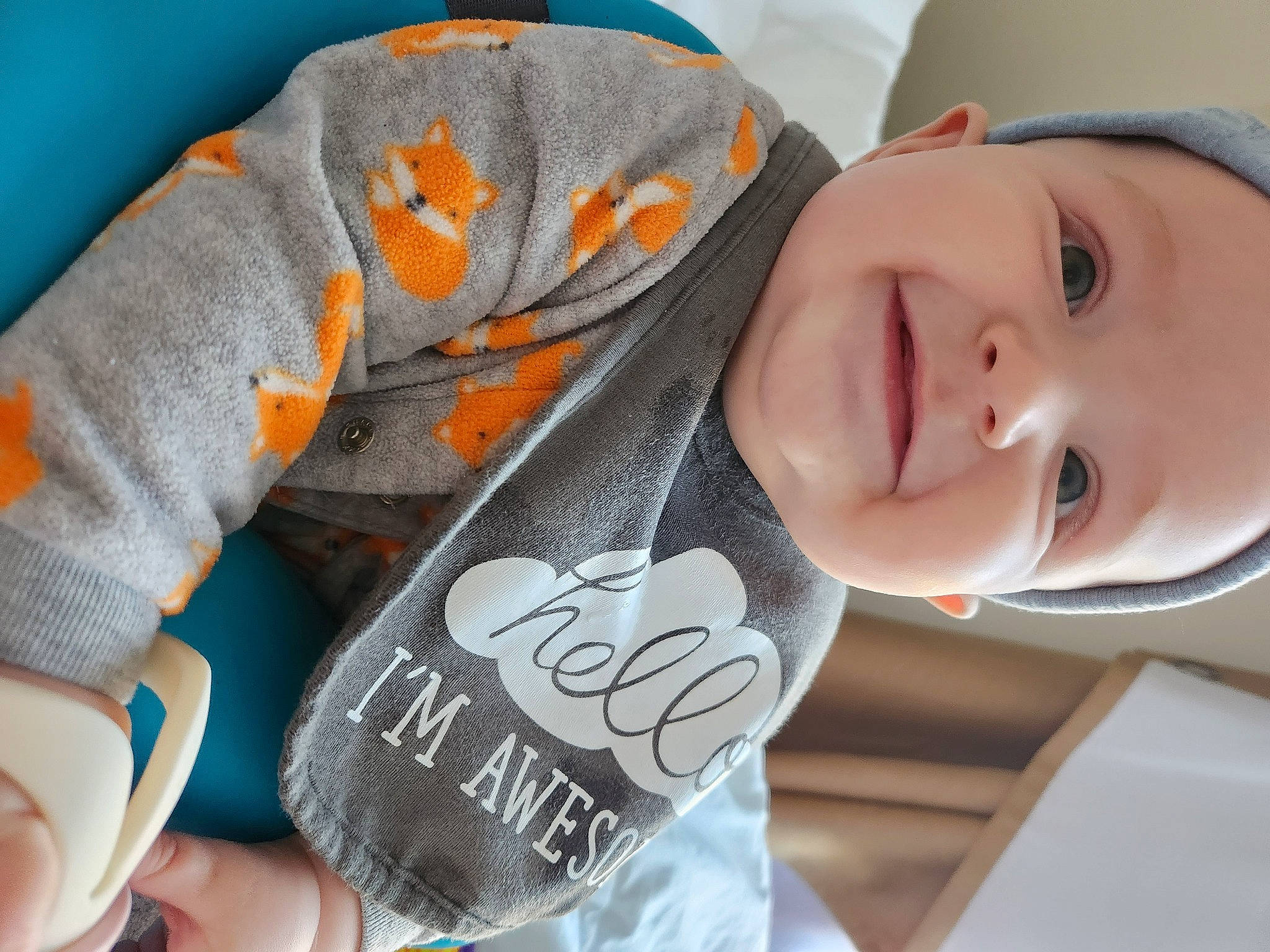 Micah joined the competition — help win amazing prizes! baby, baby_laughing, cheek, chin, comfort, eyebrow, facial_expression, finger, gesture, happy, head, headgear, lip, mouth, neck, nose, person, skin, sleeve, smile