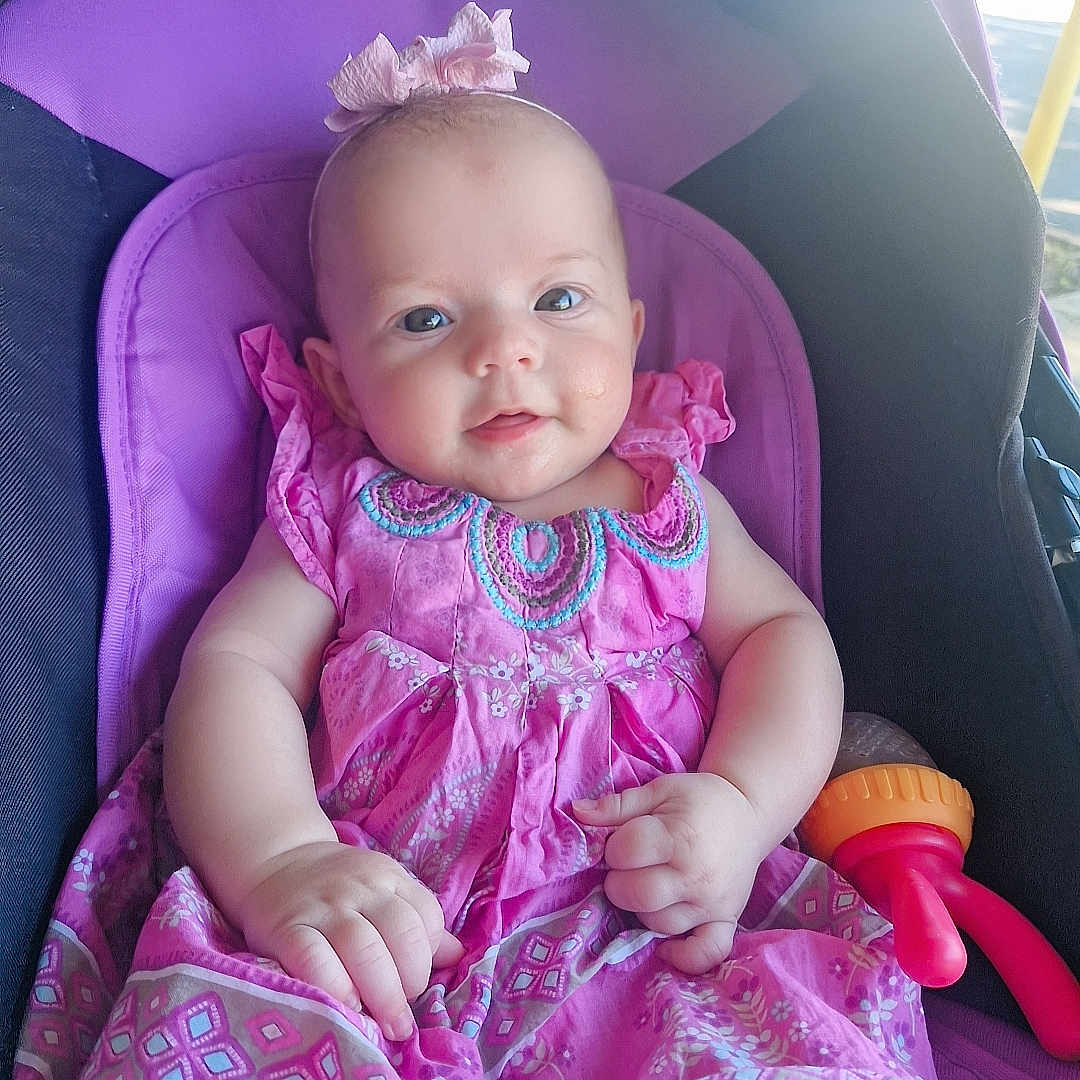 Charlotte-Rose joined the competition — help win amazing prizes! accessories, baby, bodypart, bonnet, car, clothing, cushion, dress, face, finger, hand, hat, head, homedecor, person, photography, portrait, purple, transportation, vehicle