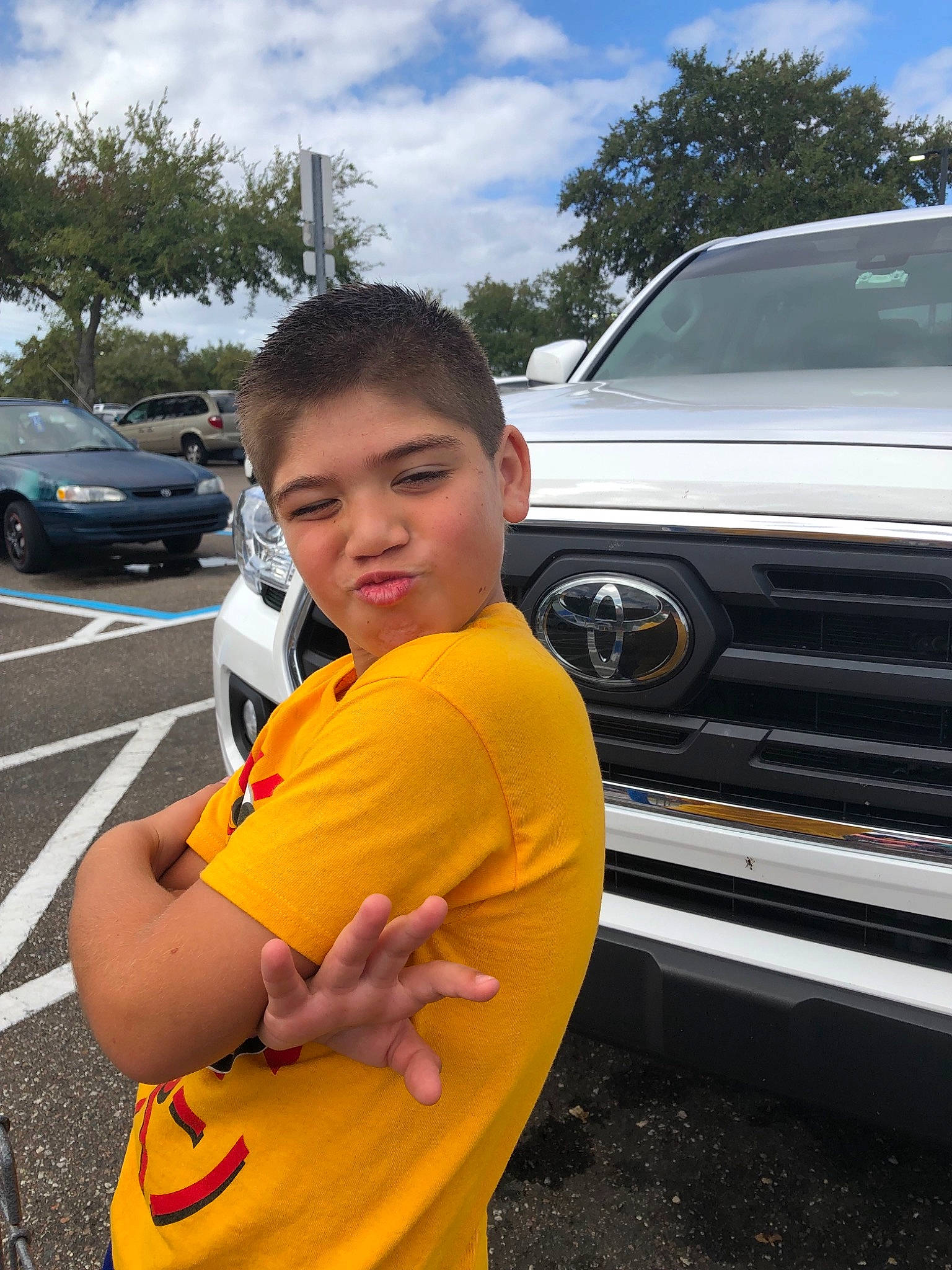 Nathanael is registered to the contest to win money with this photo: asphalt, automotive_exterior, car, city_car, motor_vehicle, person, smile, subcompact_car, vacation, vehicle, vehicle_door, yellow
