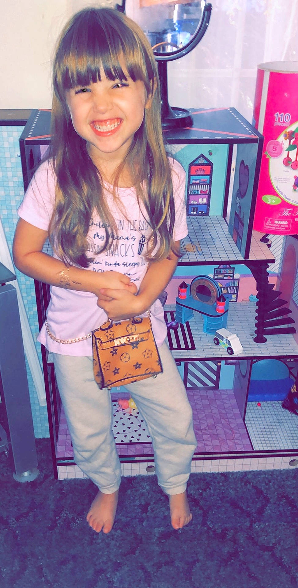 Leeanne is registered to the contest to win money with this photo: bangs, brown_hair, child, child_model, clothing, cool, headgear, jeans, joy, long_hair, person, pink, shoe, smile, t_shirt