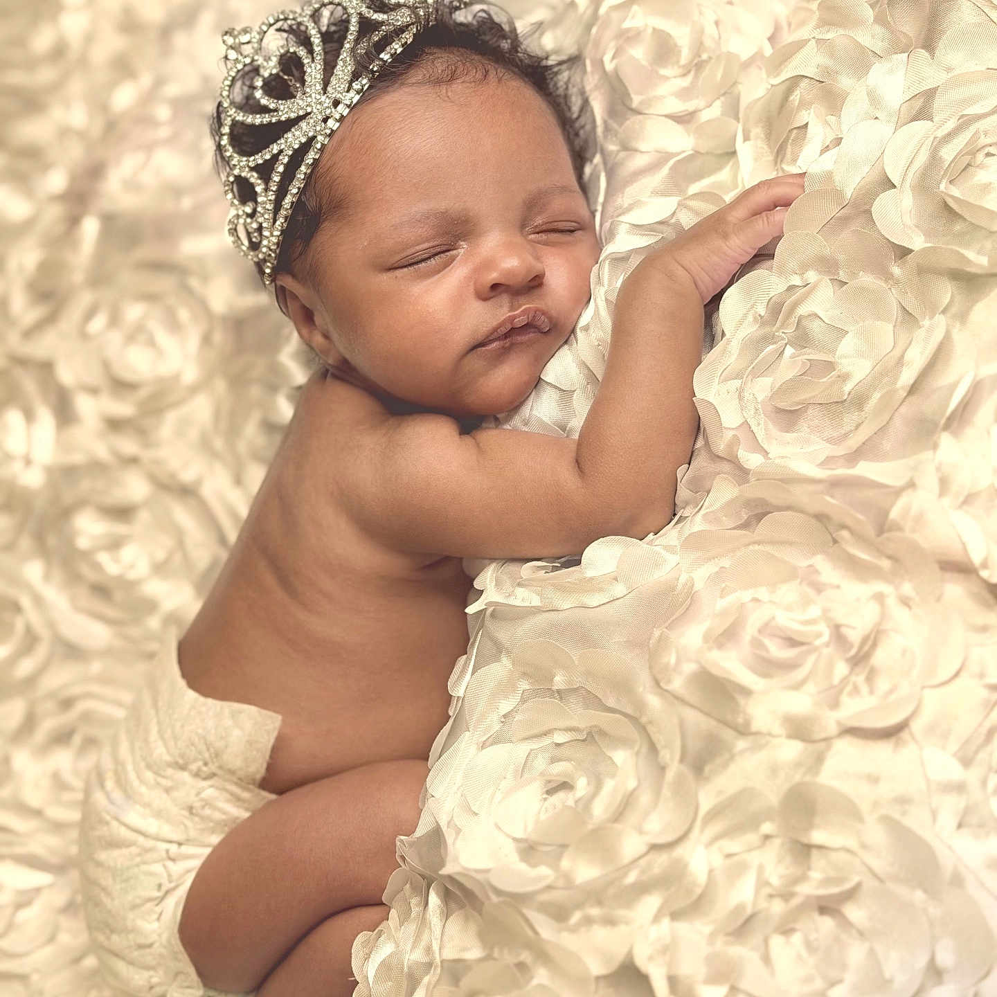 Kenzlie is registered to the contest to win money with this photo: adorable, baby, blanket, child, closeup, cozy, cute, diaper, flower_pattern, headwear, infant, lying_down, newborn, peaceful, portrait, resting, skin, sleeping, soft_texture, tiara