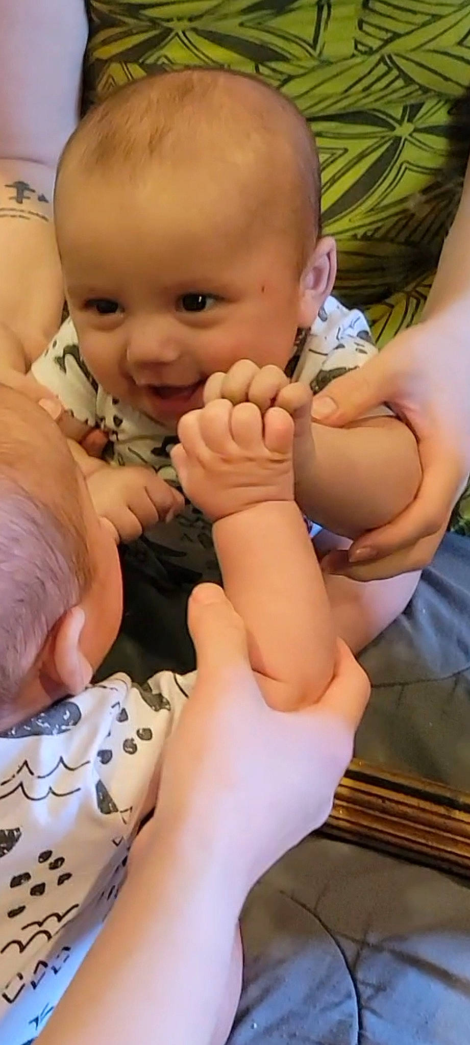 Galu is registered to the contest to win money with this photo: arm, baby, baby_toddler_clothing, cheek, chest, comfort, finger, gesture, hand, happy, head, human_body, joint, muscle, nail, person, skin, smile, stomach, thumb