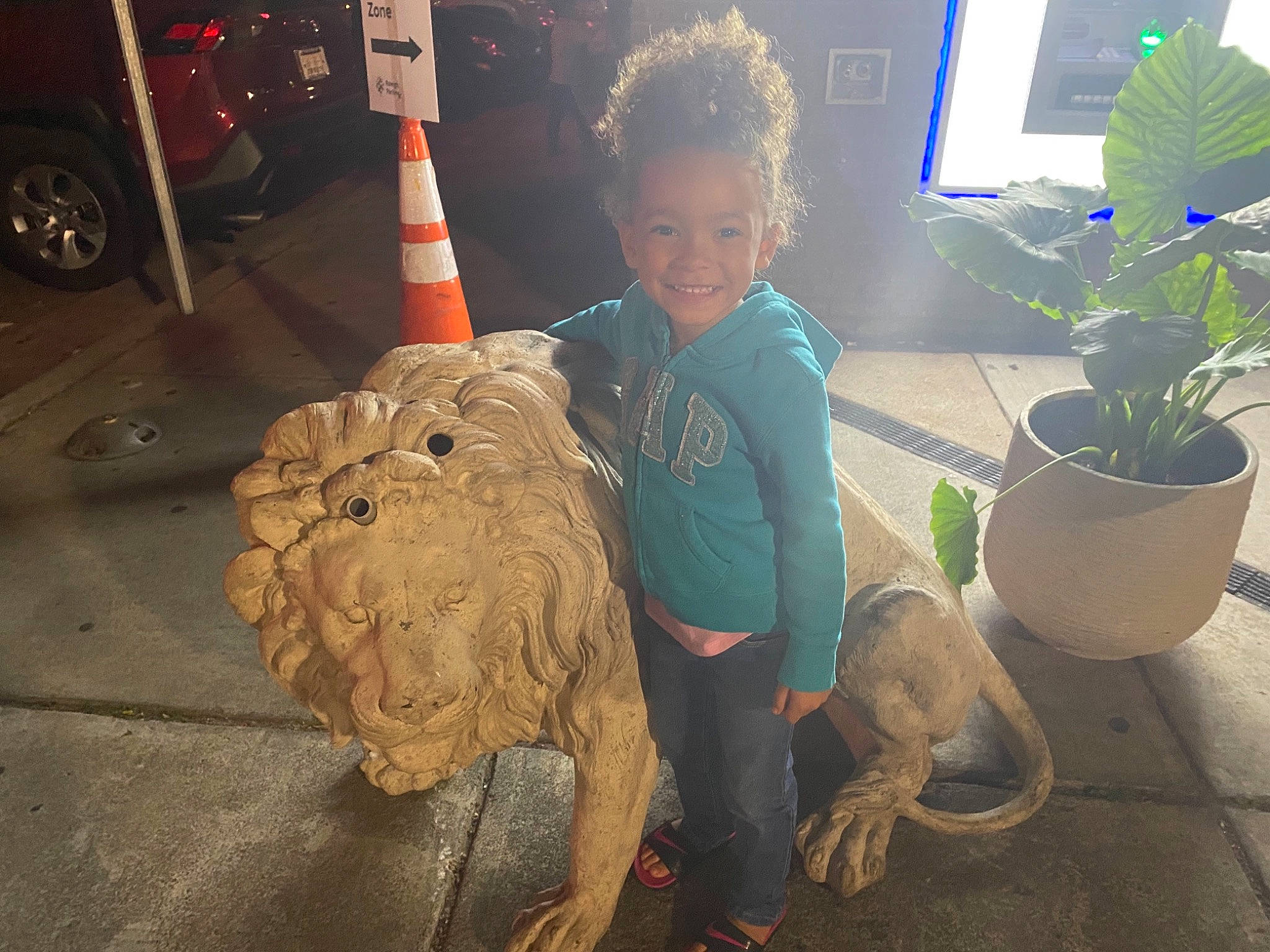 Rylan is registered to the contest to win money with this photo: art, artifact, flowerpot, fun, grass, herb, houseplant, joy, lawn_ornament, mammal, person, plant, sculpture, smile, statue, t_shirt, terrestrial_plant, tire, toddler, tree