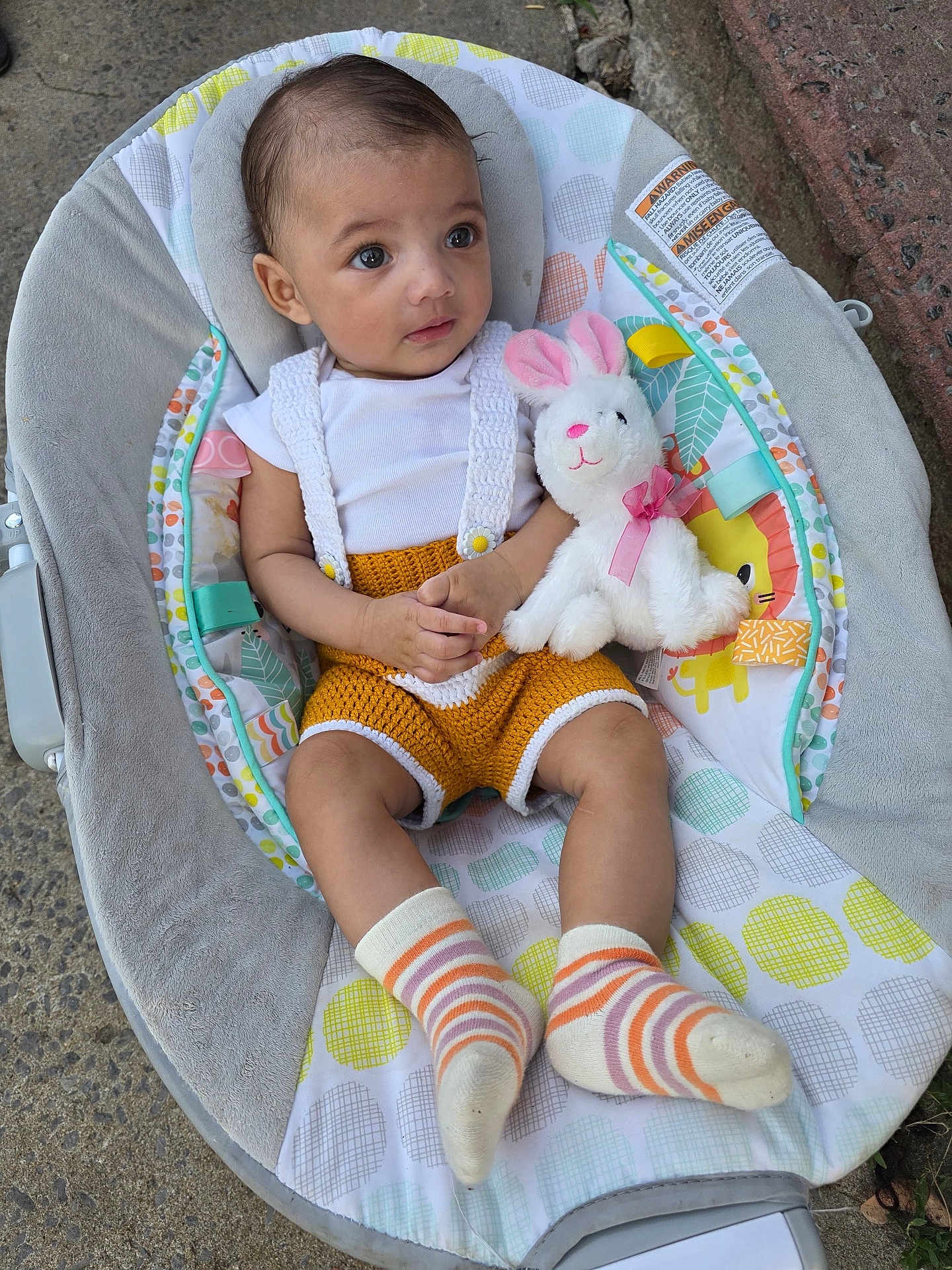 Analaxia joined the competition — help win amazing prizes! baby, infant, baby_rocker, plush_toy, bunny, striped_socks, knitted_clothing, cute, child, outdoor, seat, colorful, playful, young_child, adorable, portrait, looking_away, soft_toy, casual, footwear