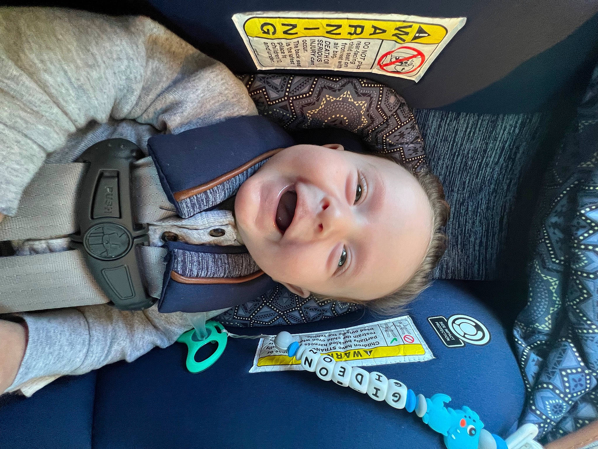 Gideon joined the competition — help win amazing prizes! auto_part, car_seat, cheek, child, comfort, electric_blue, eyebrow, eyelash, fun, happy, jaw, person, sleeve, smile, street_fashion, travel